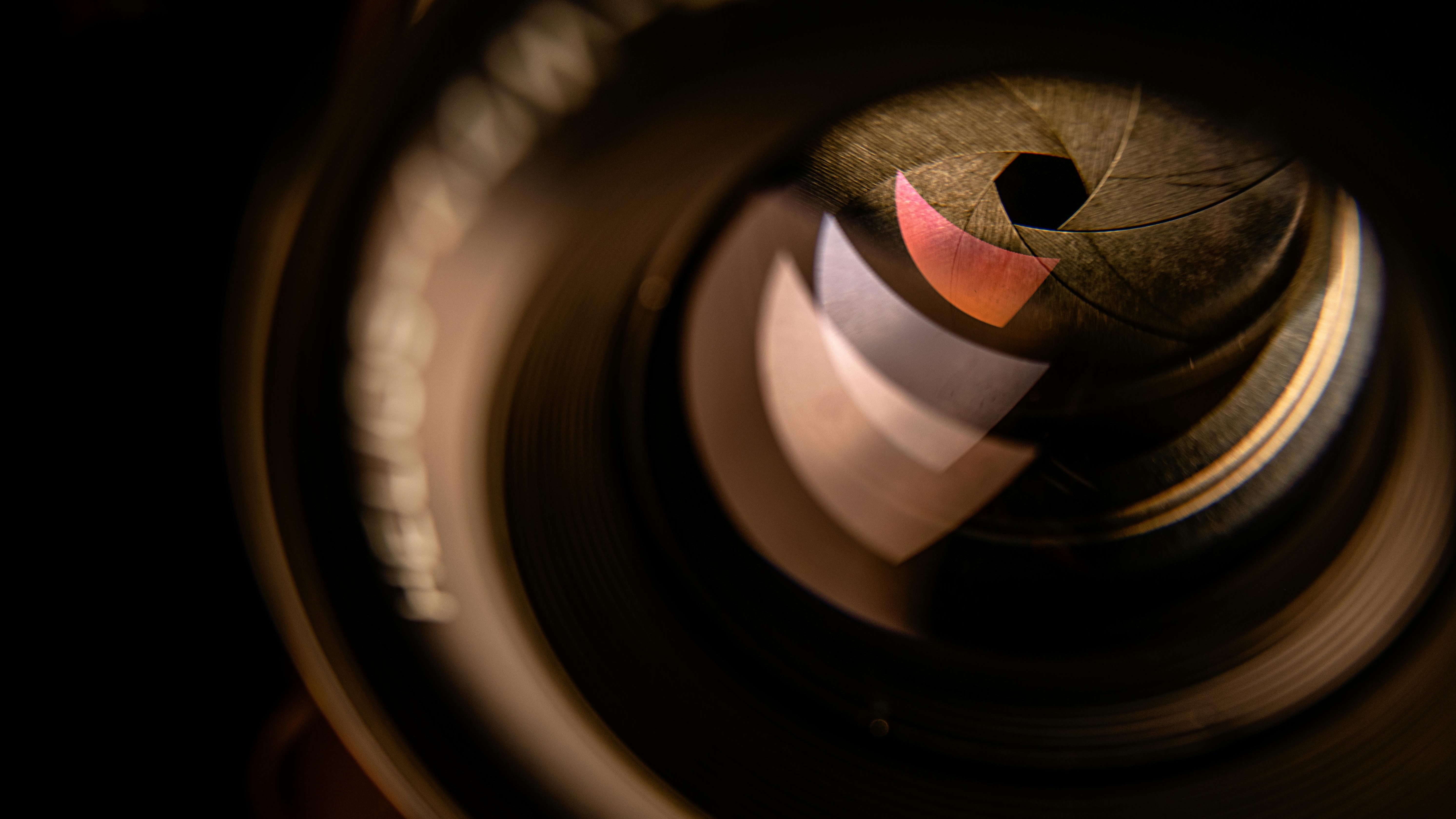 Corporate event photography showing professional business conference with stage lighting and audience in formal setting